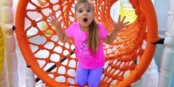 Diana and Roma have fun playing at the Indoor Playground for kids