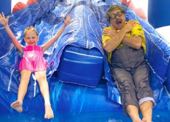 Nastya has fun at home on a large children's trampoline