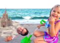 Diana and Roma have fun on the Beach with Daddy